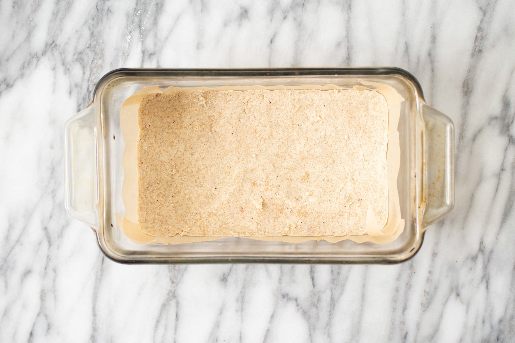 vegan pumpkin pie bars almond flour crust in a glass loaf pan