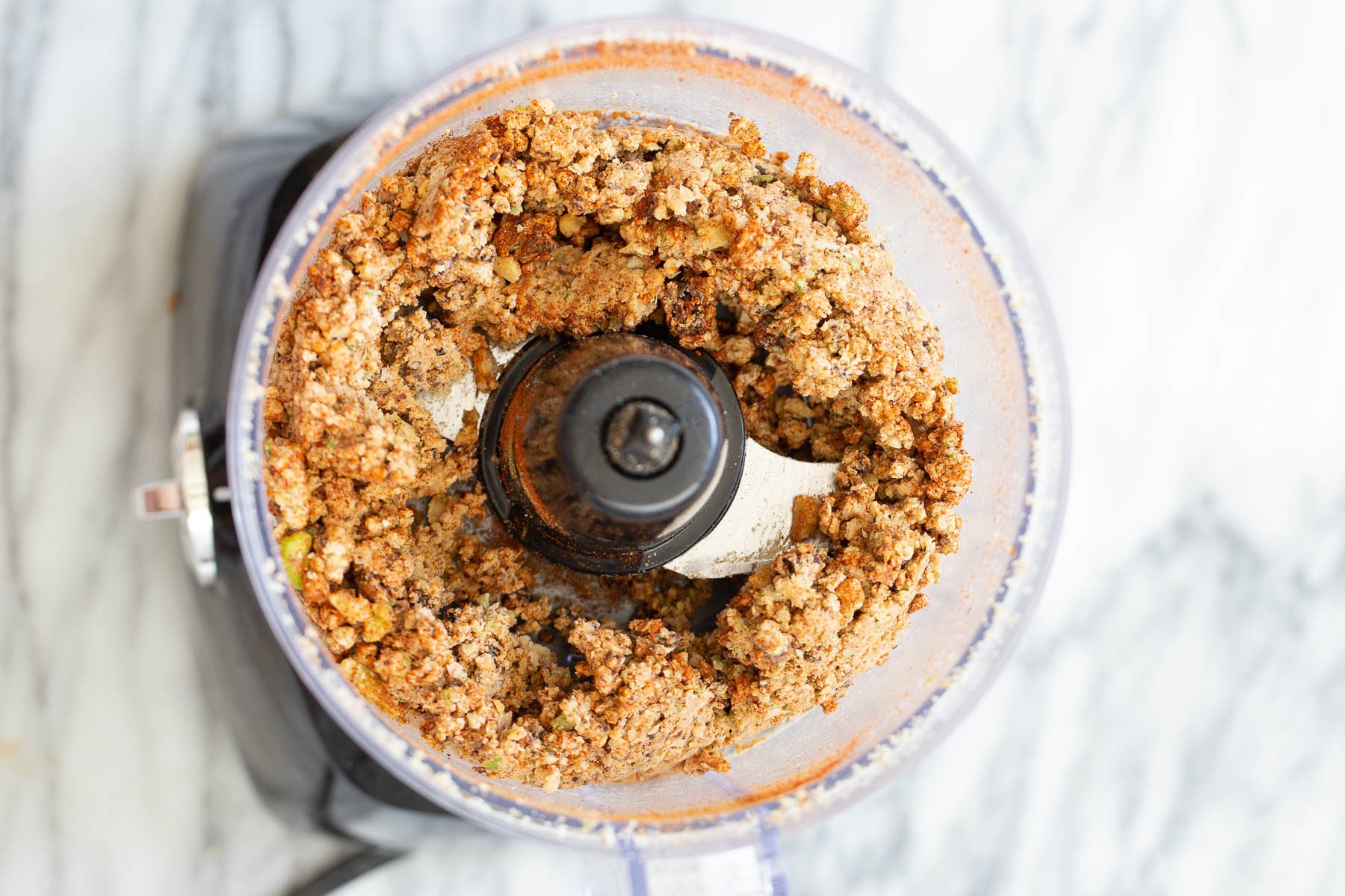 walnut taco meat  overhead shot of vegan walnut taco meat in a food processor