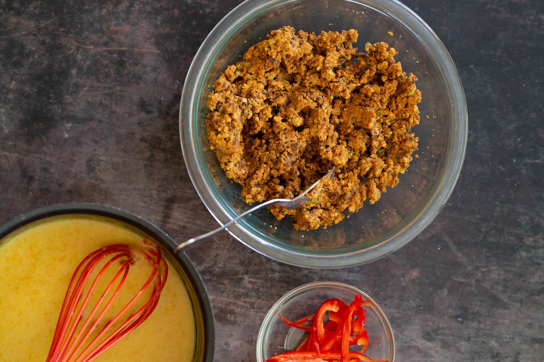 walnut taco meat vegan nacho cheese, taco meat and bell pepper in separate bowls ready for making vegan quesadilla recipe