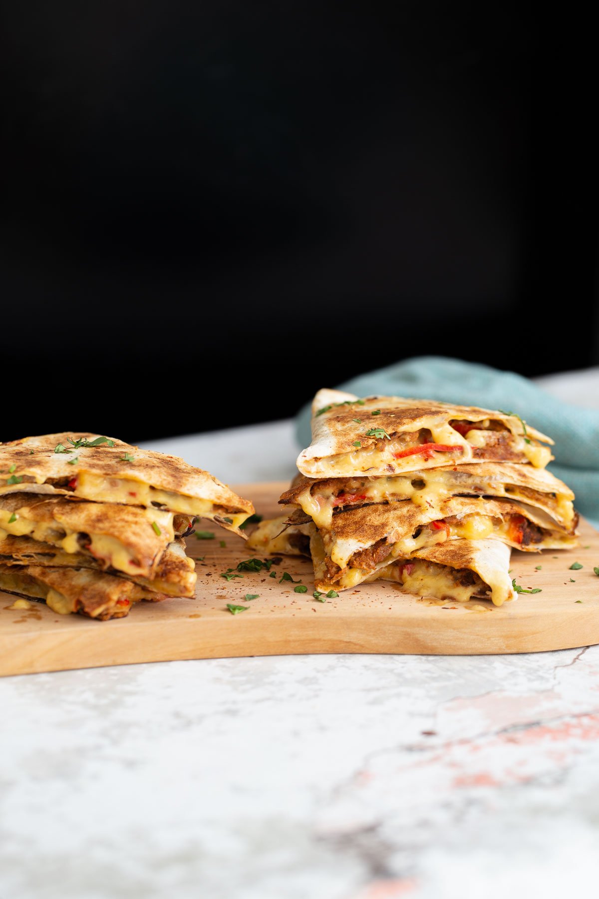 walnut taco meat  side view of vegan quesadillas filled with vegan walnut taco meat, bell pepper and melted cheese