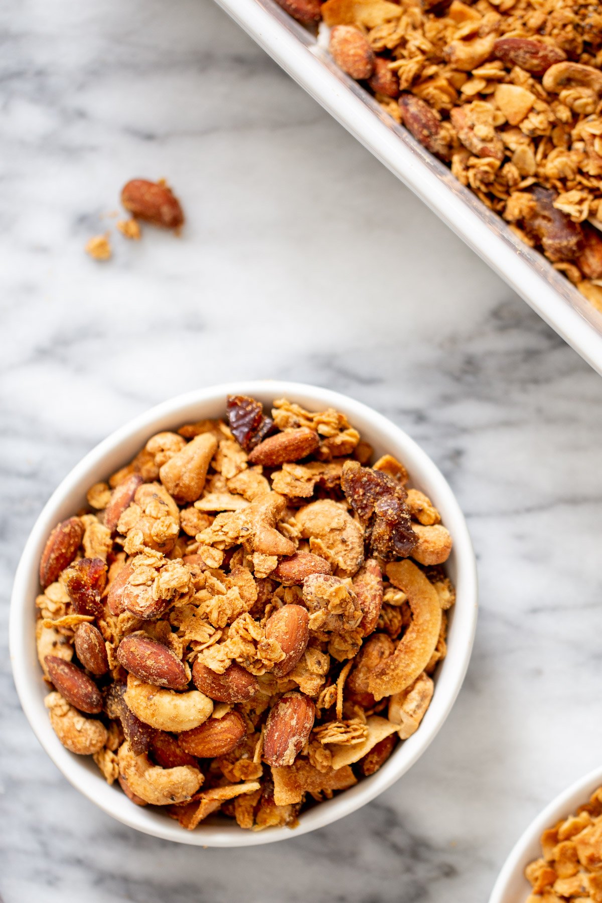 coconut granola overhead shot of a bowl of baked vegan coconut almond granola
