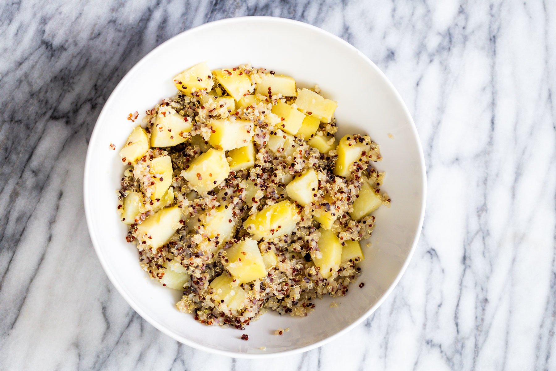 vegan quinoa waffles cooked potatoes and quinoa in a small bowl