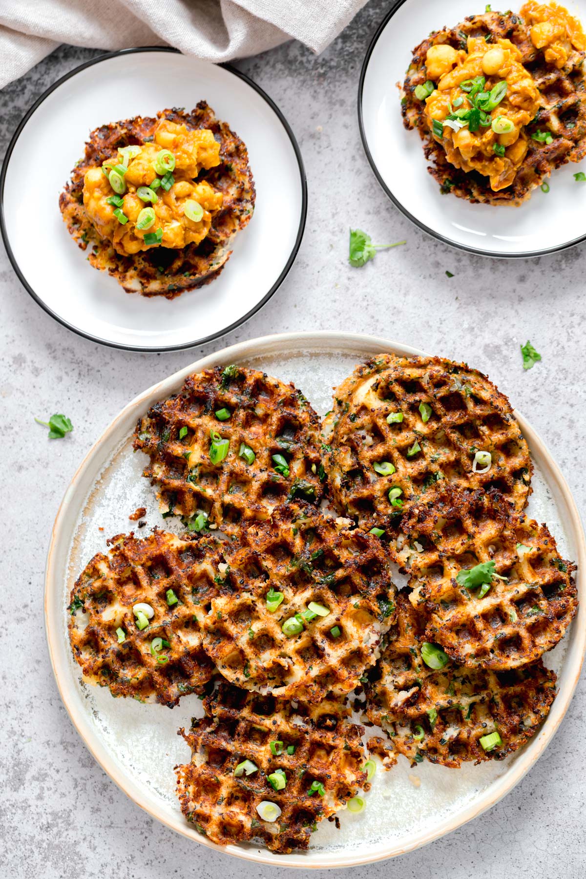 vegan quinoa waffles overhead shot of vegan potato quinoa waffles sprinkled with chopped chives