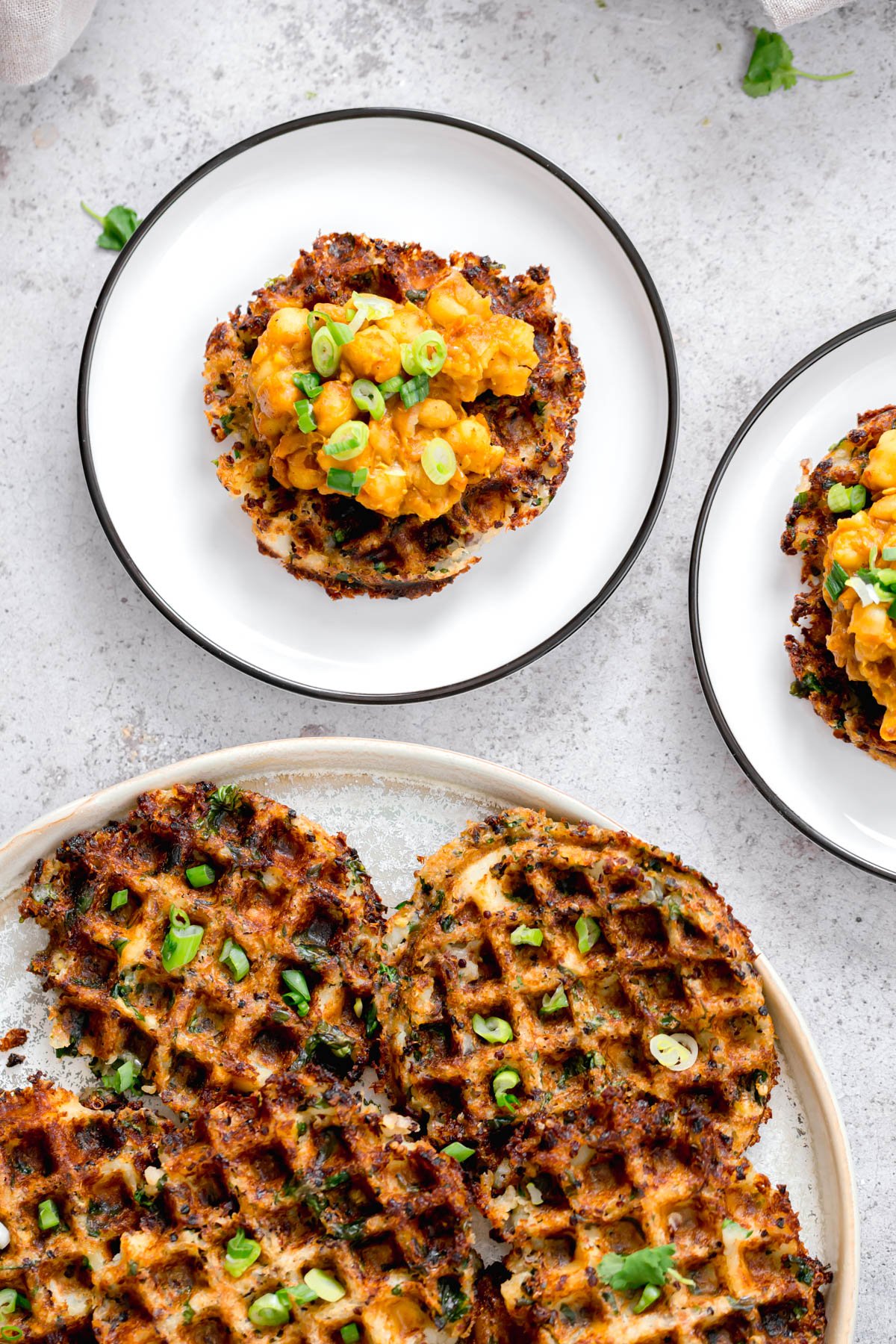 vegan quinoa waffles vegan quinoa potato waffles topped with chopped chives and smashed chickpeas