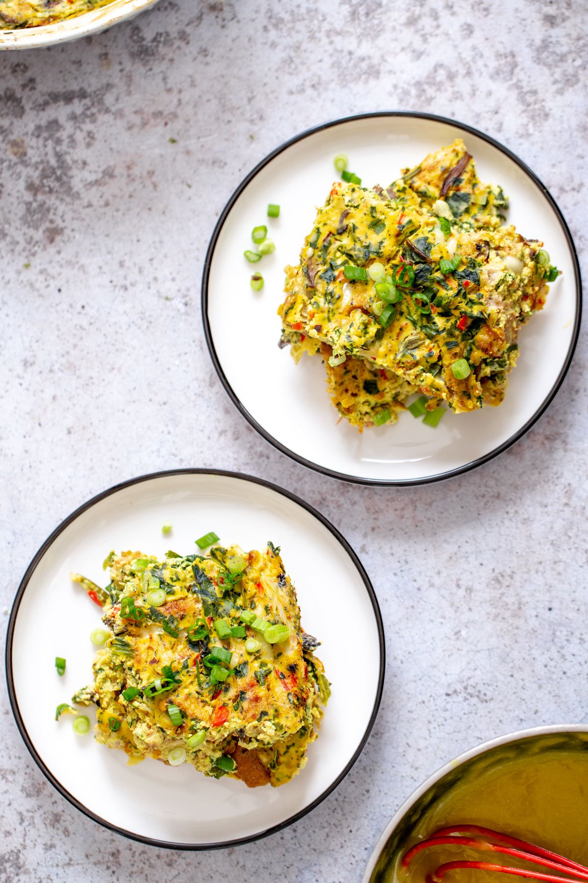 vegan breakfast casserole two servings of vegan breakfast casserole sprinkled with green onions