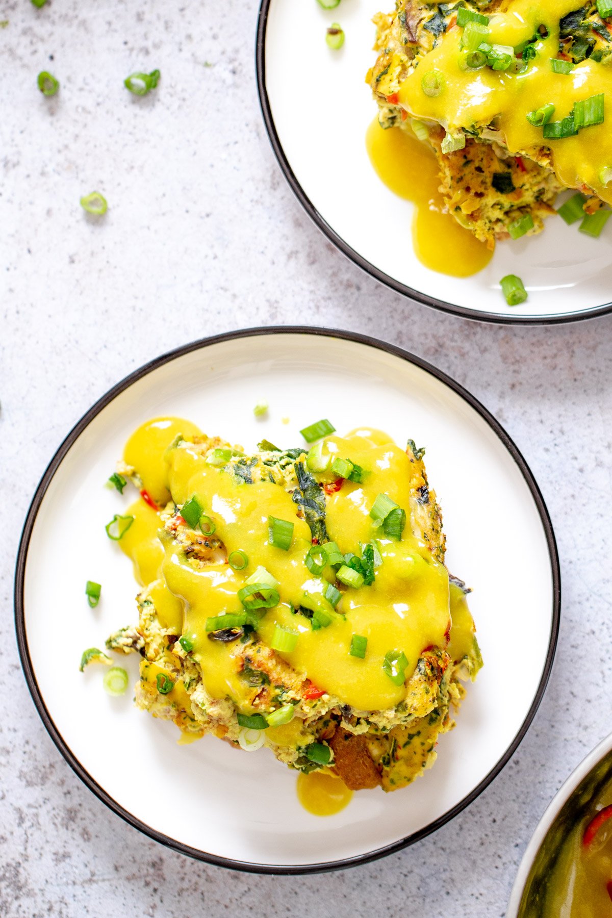 vegan breakfast casserole two servings of vegan egg casserole drizzled with vegan hollandaise sauce