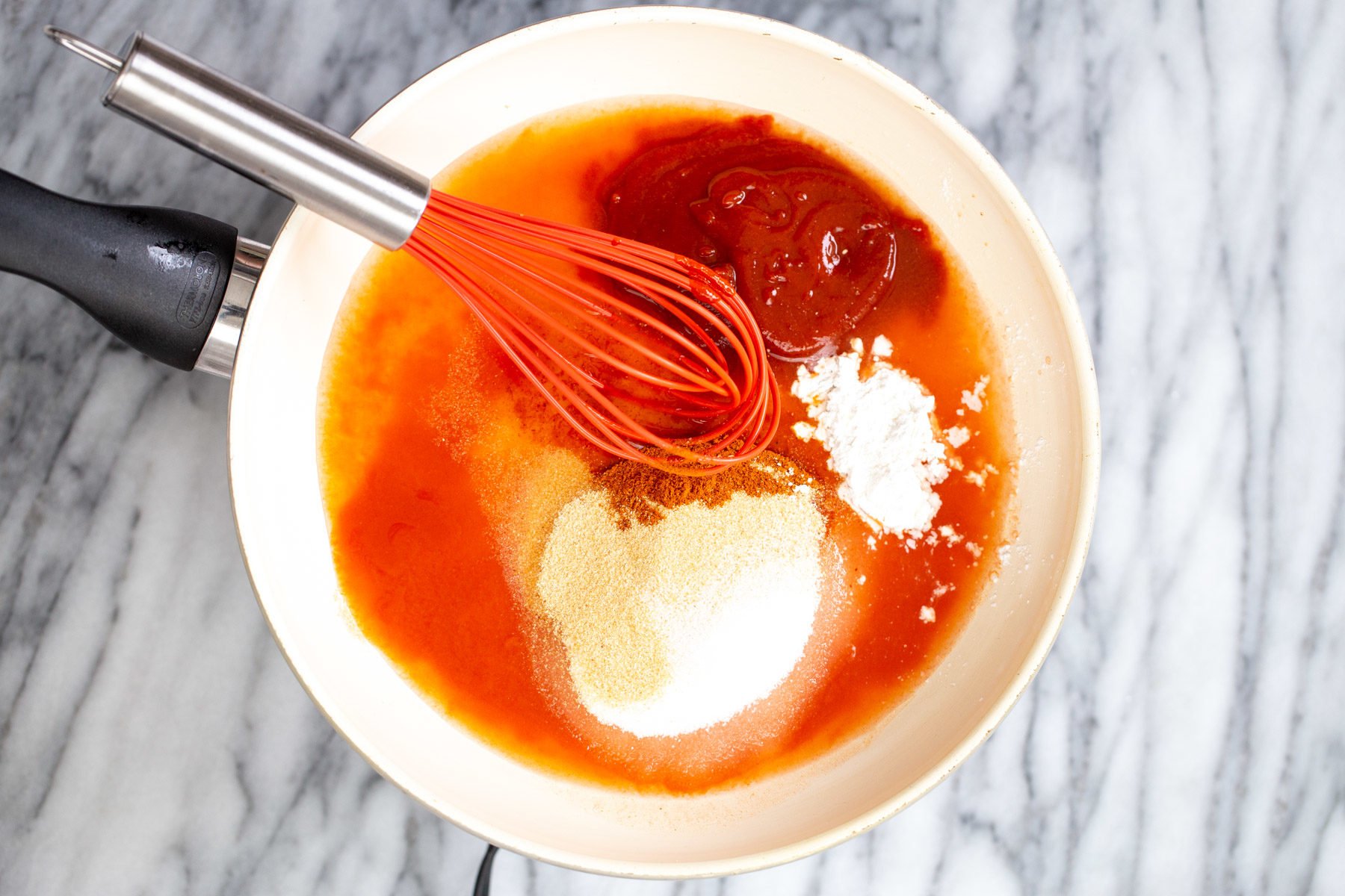 tofu wings  firecracker sauce ingredients being stirred together in a small saucepan