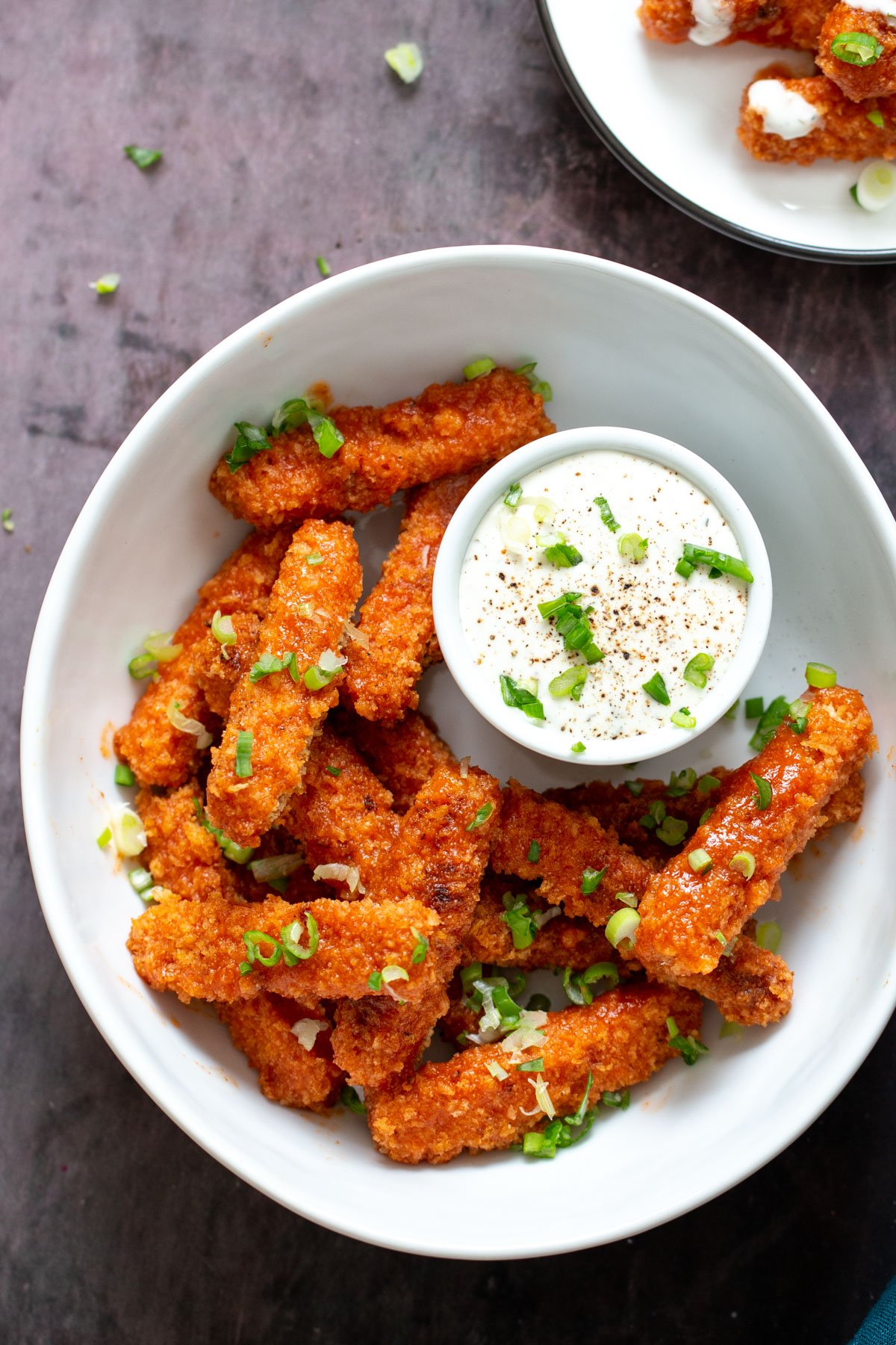 tofu wings overhead shot of a plate with vegan baked firecracker tofu wings served with side of vegan Ranch