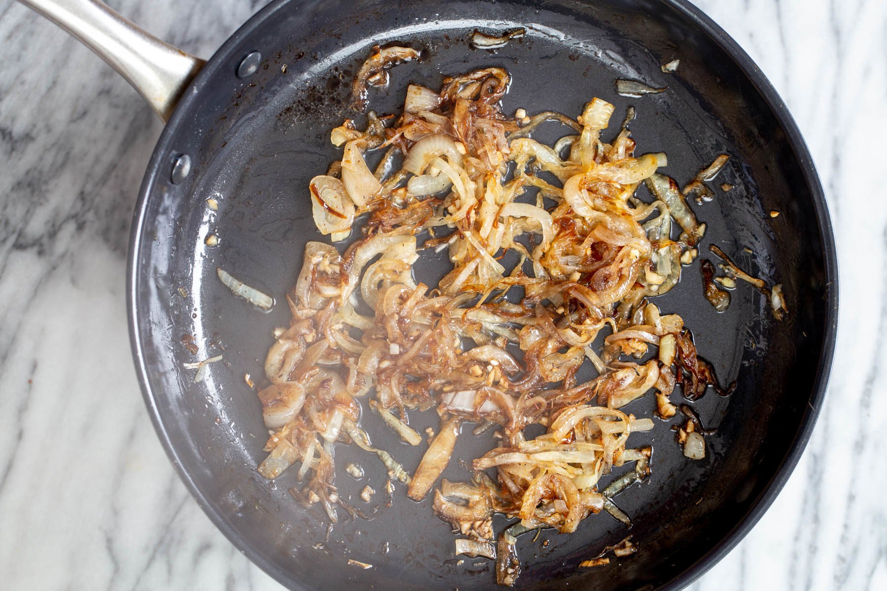 vegan skillet lasagna  caramelized browned onion in a black skillet