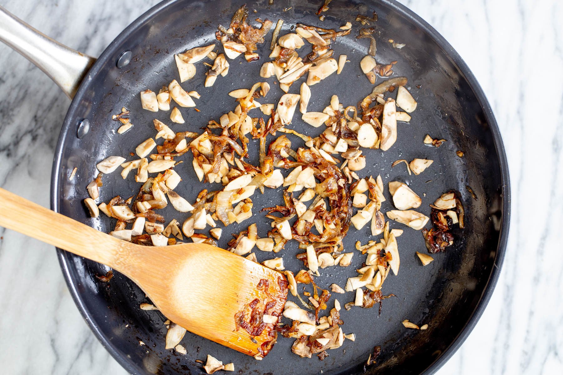 mushrooms and caramelized onion in a black skillet
