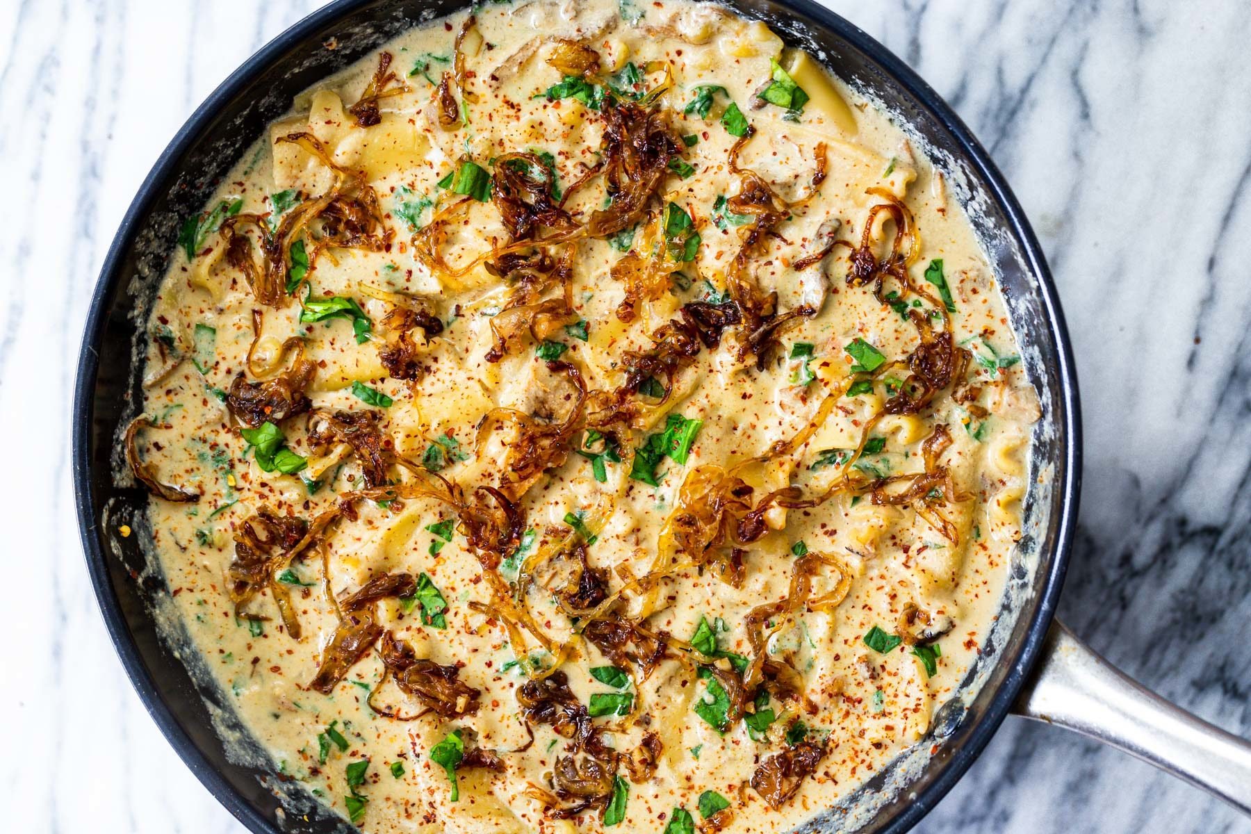 vegan skillet lasagna  a black skillet with vegan French Onion Skillet