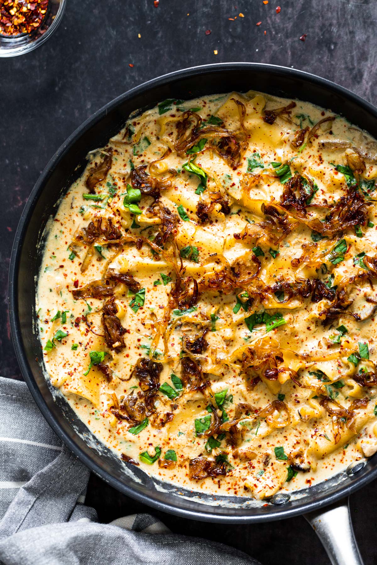 vegan skillet lasagna  a skillet with vegan French onion skillet lasagna topped with caramelized onions