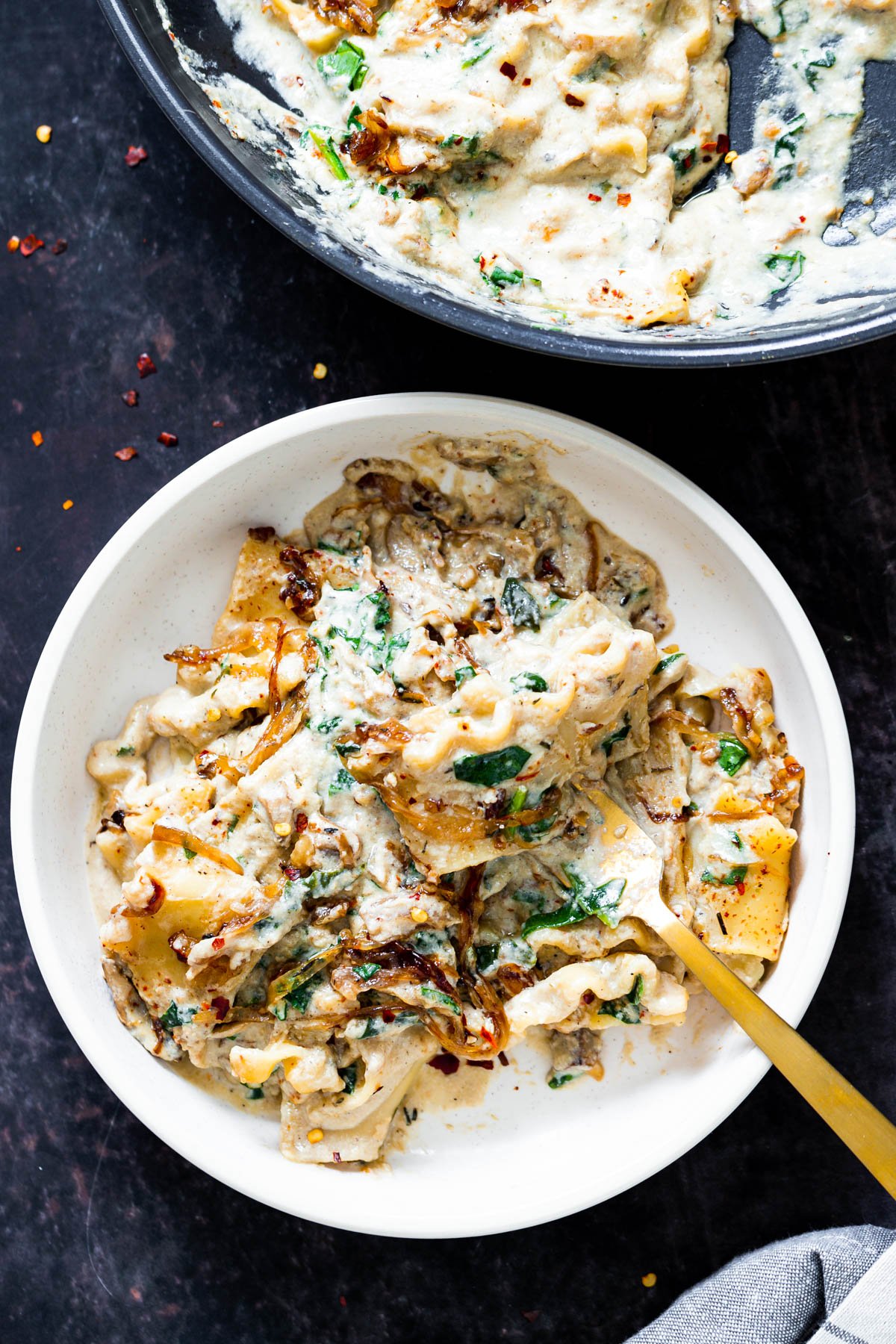 vegan skillet lasagna  a bowl of vegan skillet lasagna with a golden fork