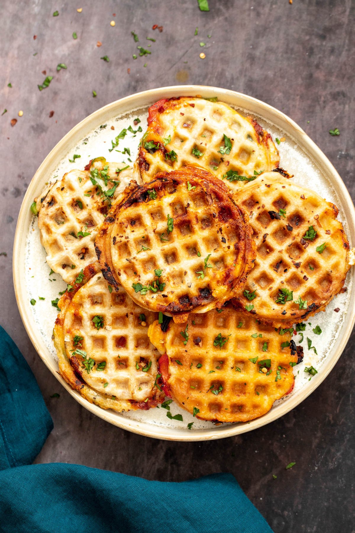 vegan pizza waffles vegan pizza waffles on a white plate with a napkin on the side