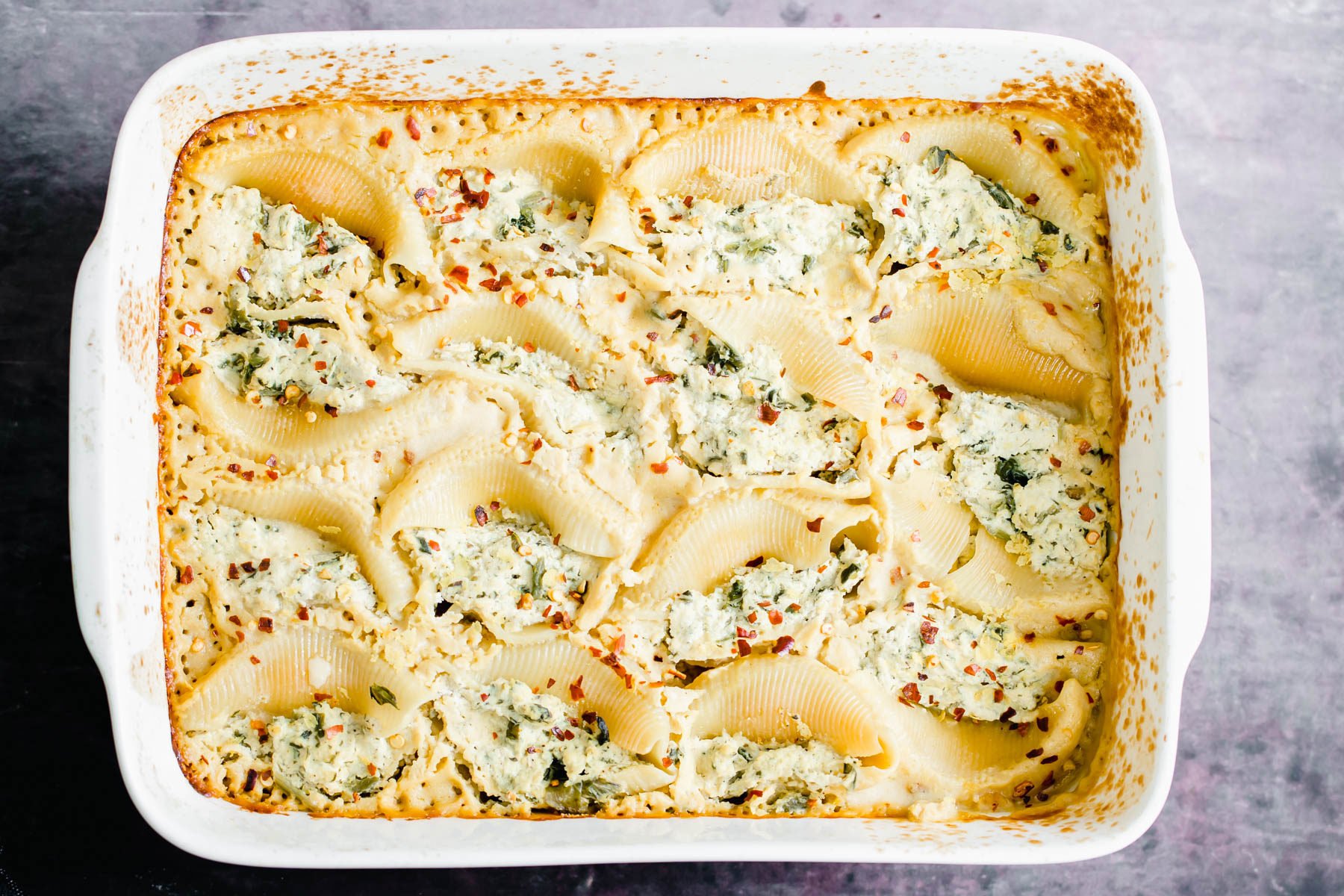 vegan stuffed shells baked vegan stuffed shells in a casserole dish