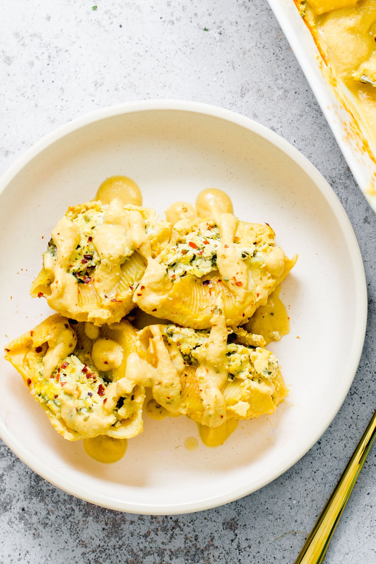 vegan stuffed shells vegan butternut squash & tofu ricotta stuffed shells on a white plate
