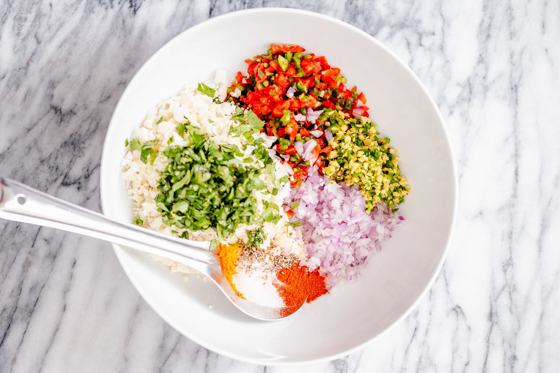 ingredients for pakora waffles in a white bowl