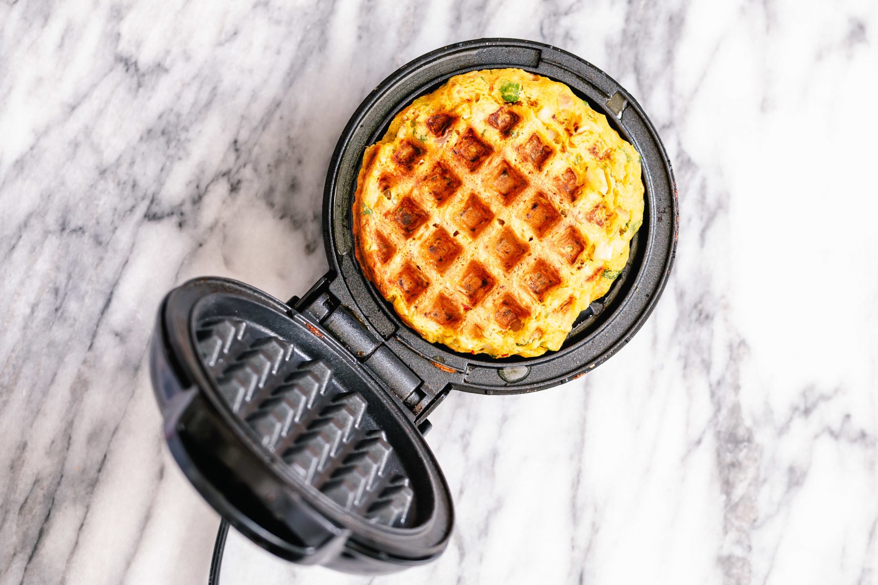 a crisp pakora waffle in a waffle maker