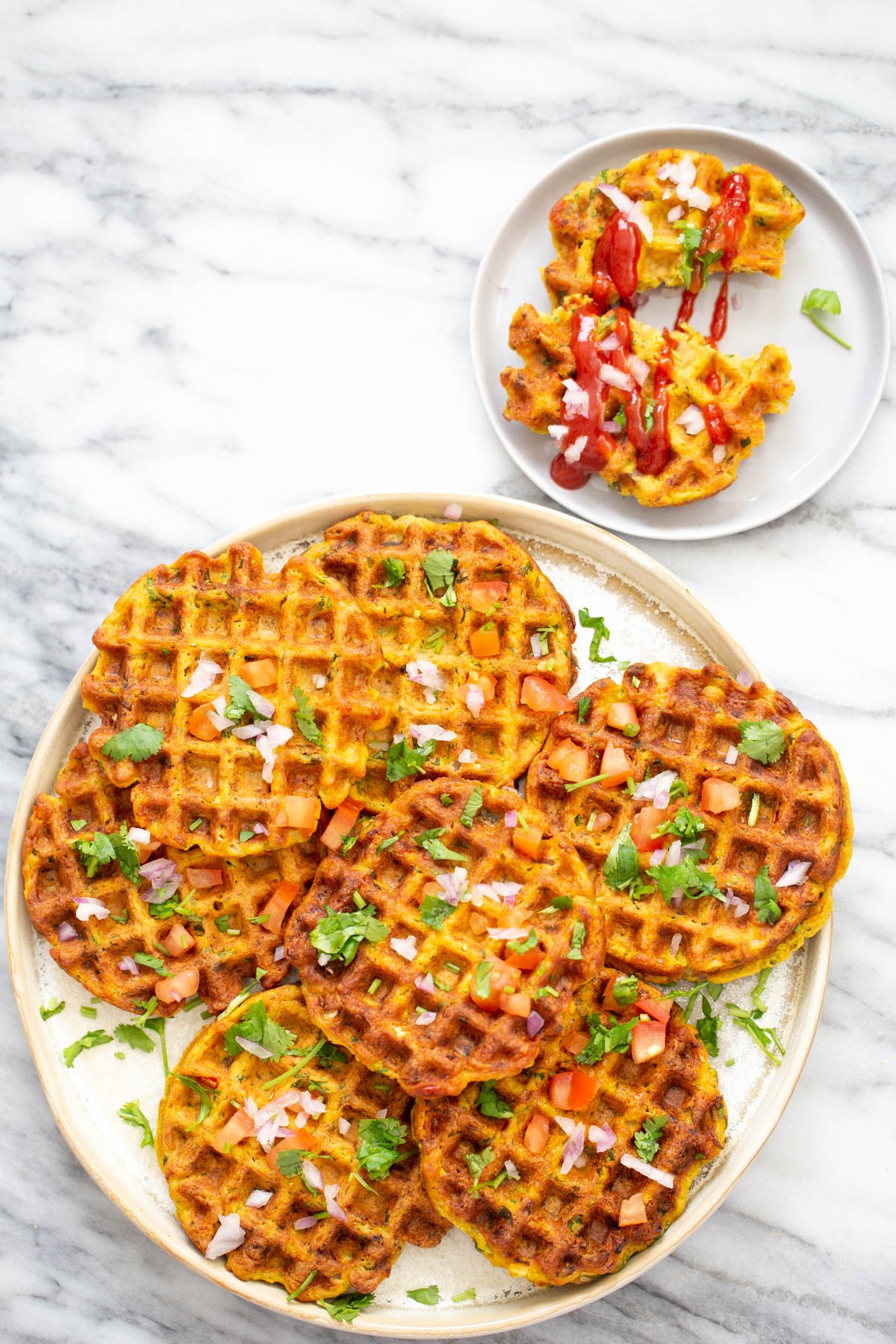 overhead shot of a plate with crispy vegan chickpea flour waffles with vegetables