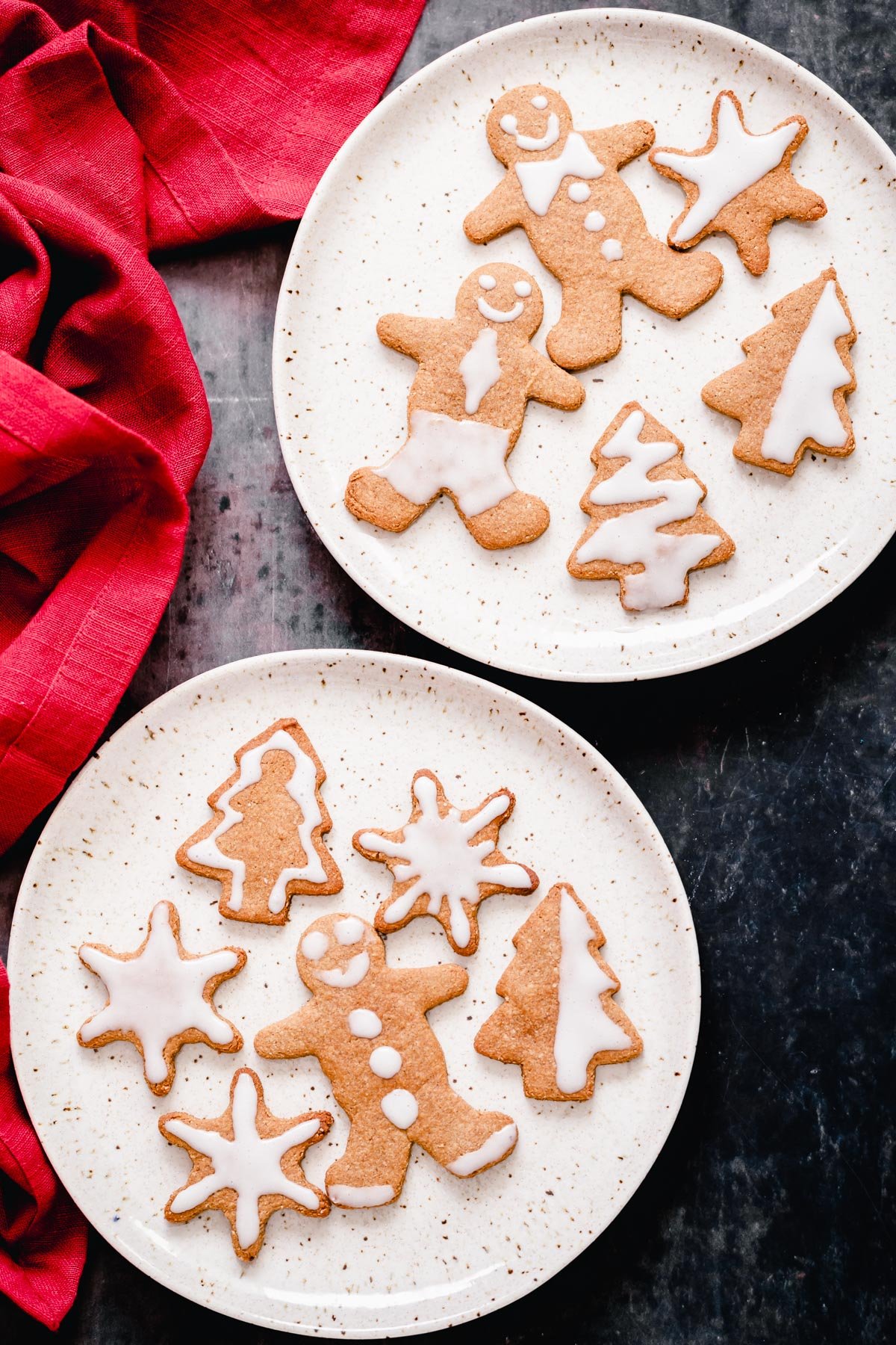 vegan gingerbread cookies overhead shot of two plates of gluten-free grain-free holiday gingerbread cookies