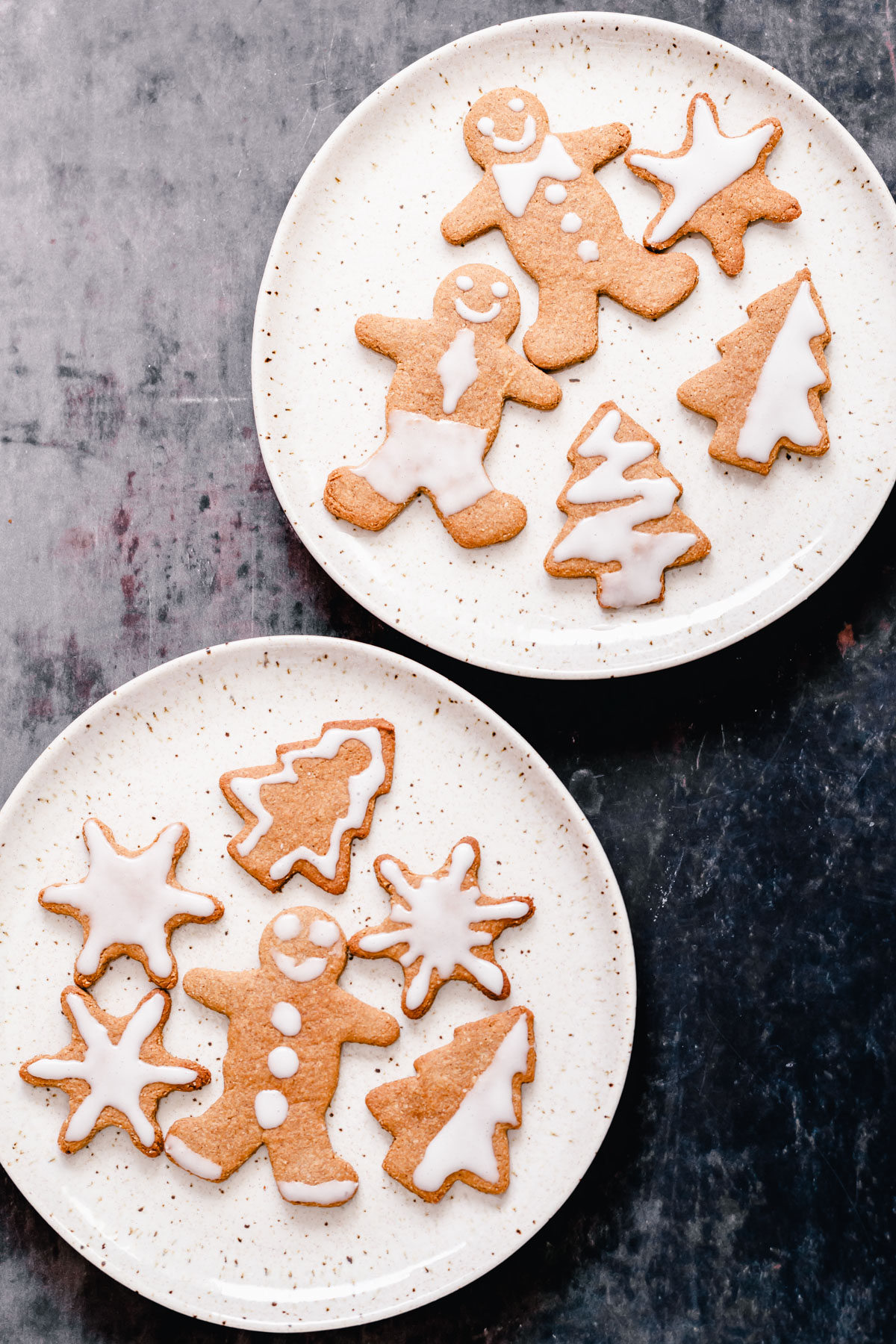 vegan gingerbread cookies  overhead shot of iced vegan gingerbread cookies