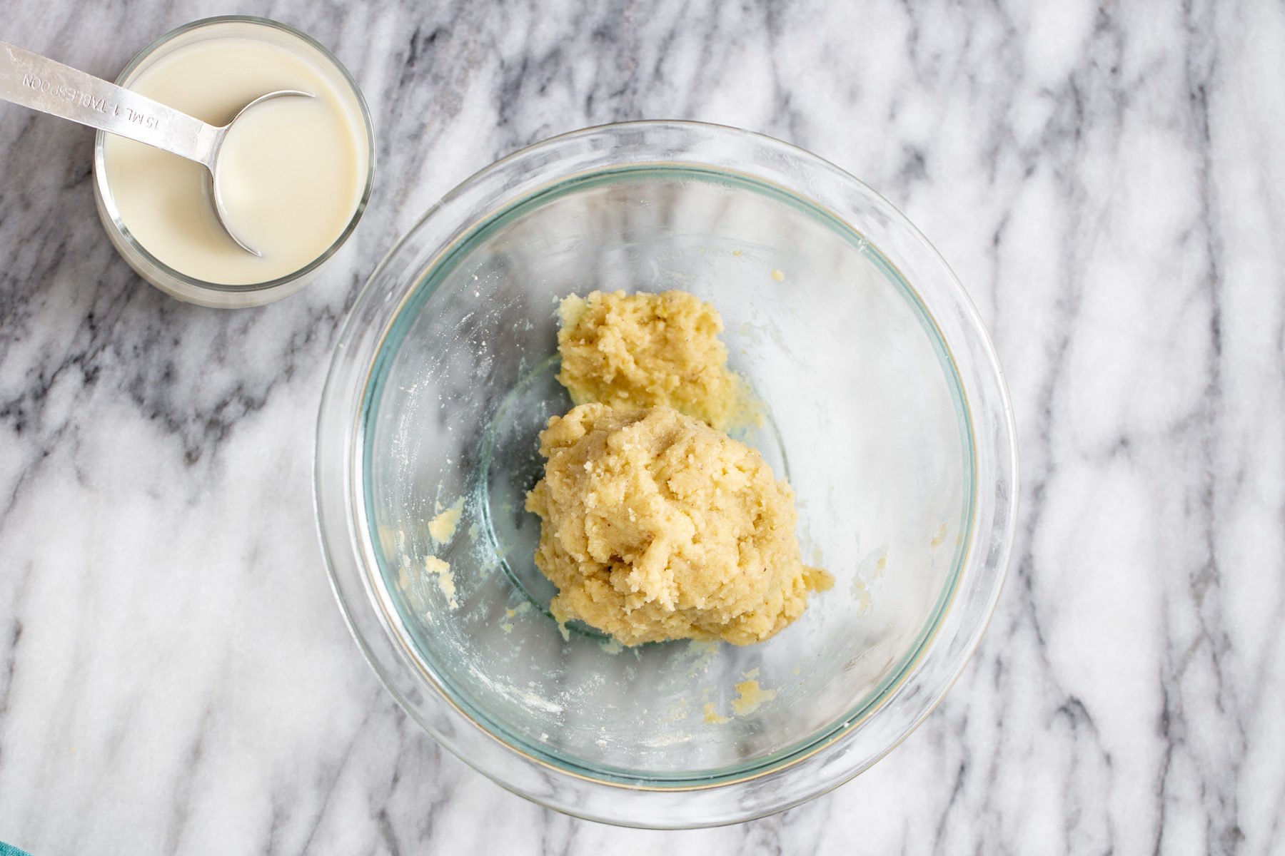 vegan gulab jamun batter in a glass bowl