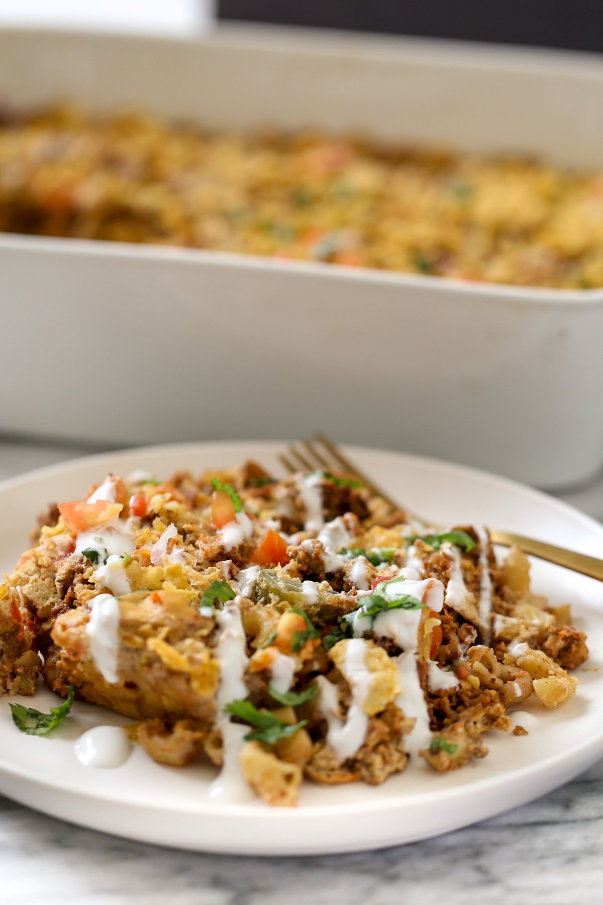 mac and cheese taco bake a serving of vegan mac and cheese taco bake drizzled with vegan sour cream