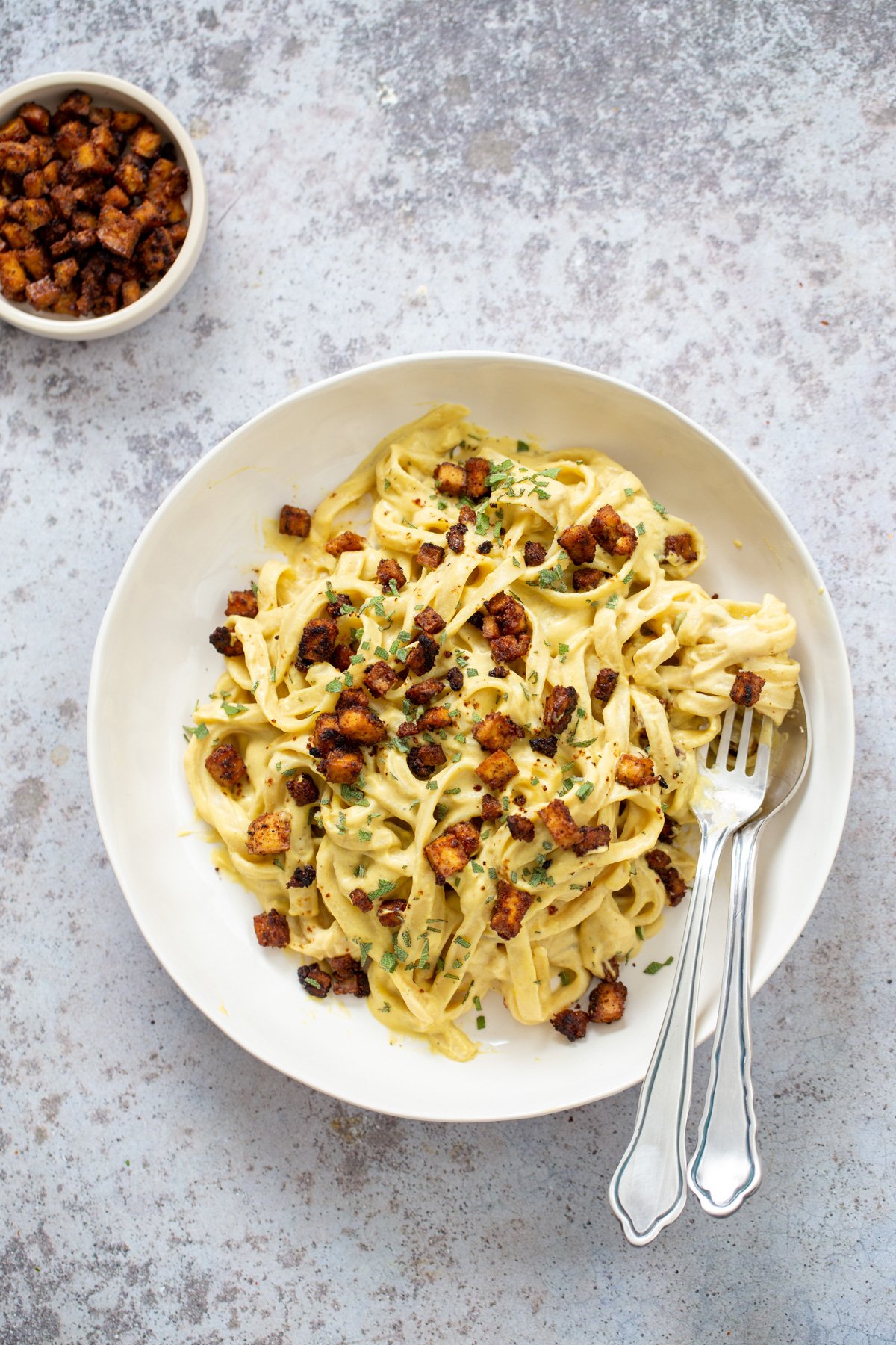 overhead shot of a vegan Butternut Squash Carbonara Pasta served with roasted tofu