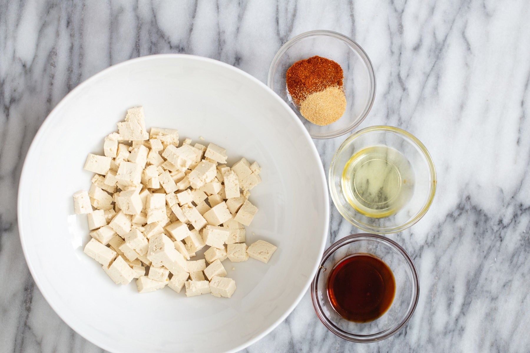 butternut squash carbonara  tofu cubes with condiments for making roasted crispy tofu as pasta topping