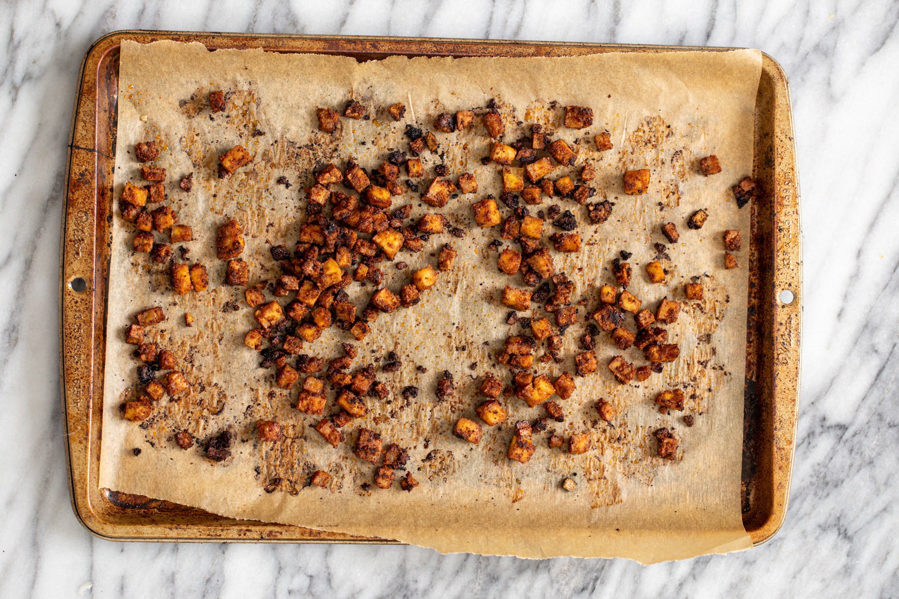 butternut squash carbonara  crispy smokey oven roasted tofu cubes on a baking sheet