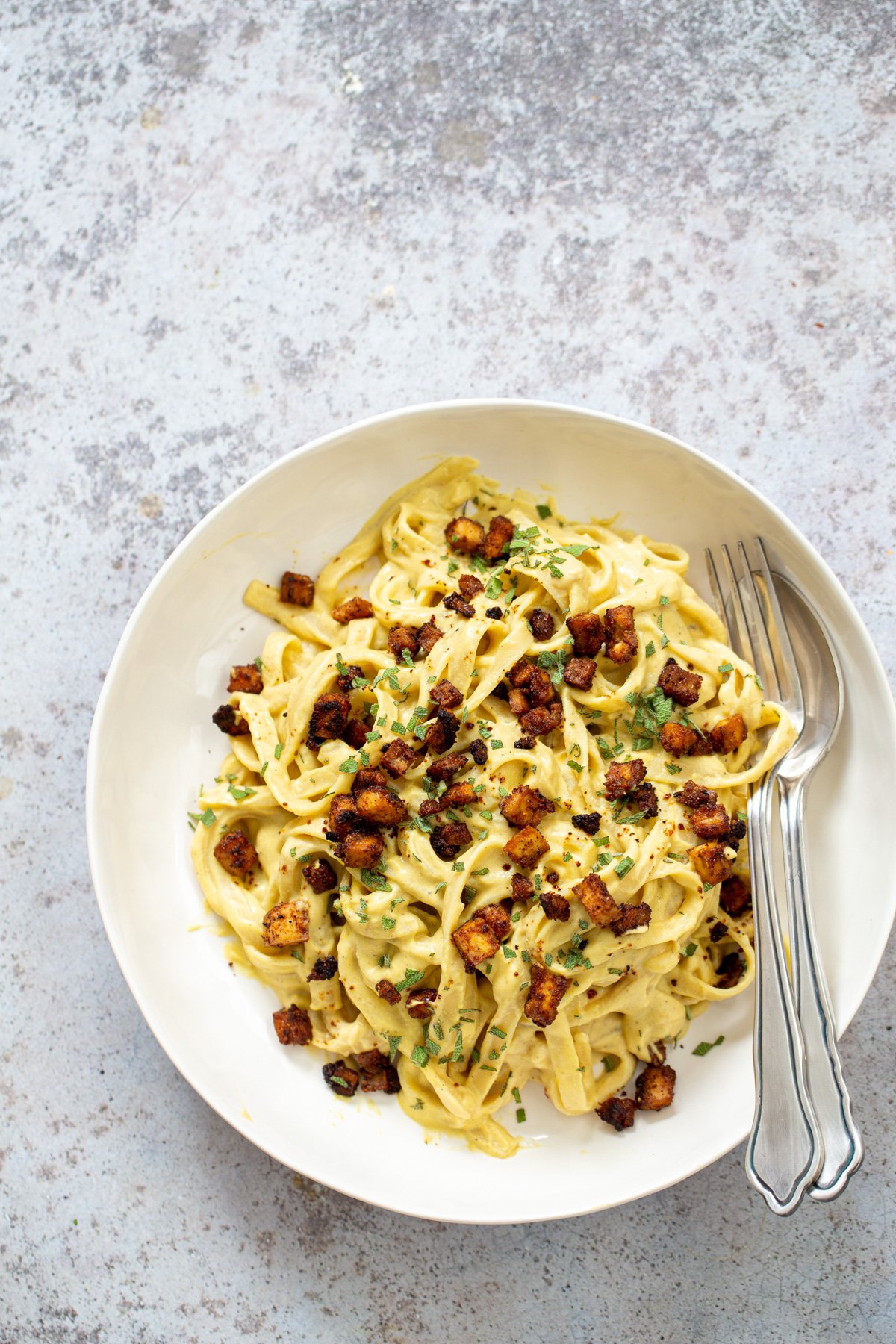 butternut squash carbonara  overhead shot of a vegan Butternut Squash Carbonara Pasta served with roasted tofu