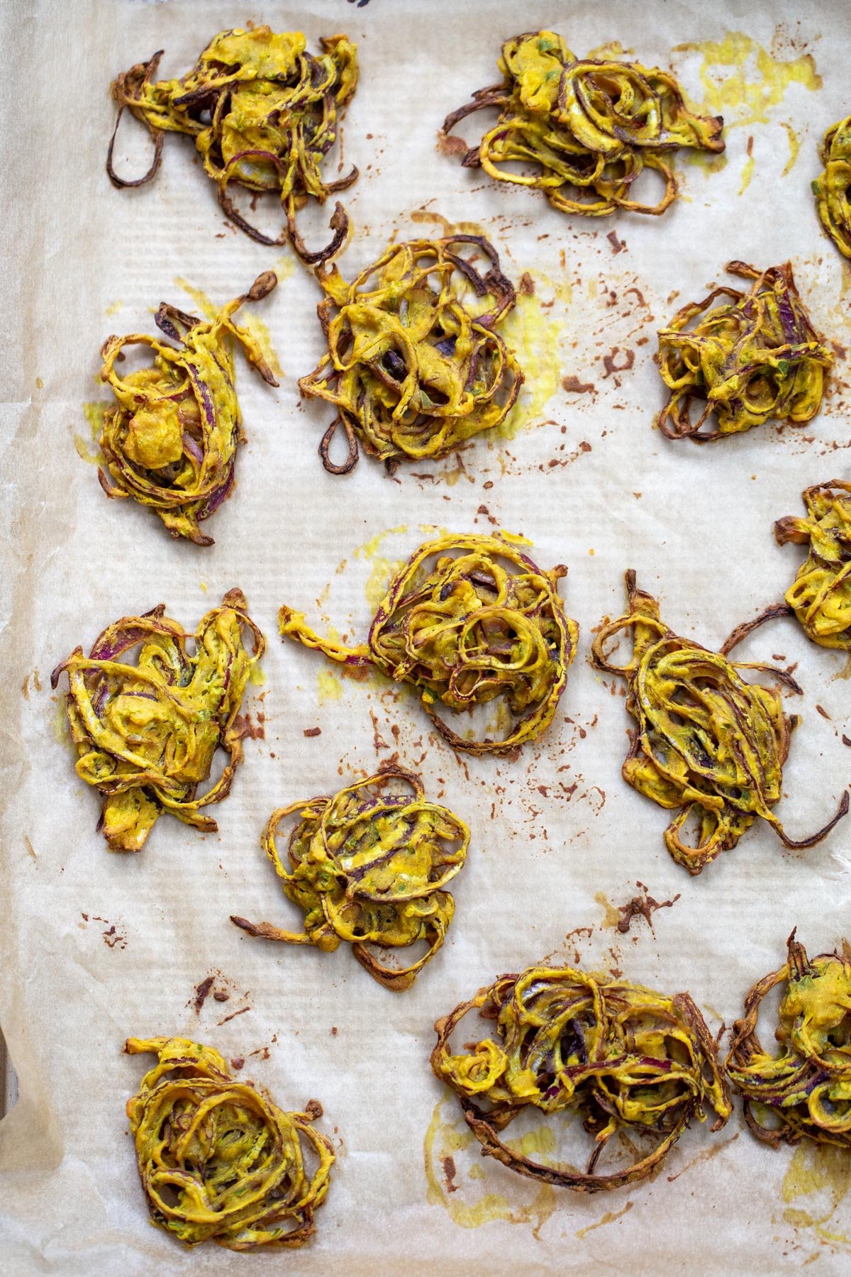 baked pakora freshly baked onion pakora on a baking sheet
