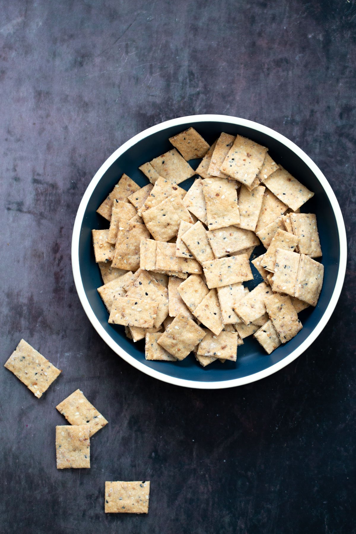 everything bagel crackers  a bowl with vegan everything bagel crackers