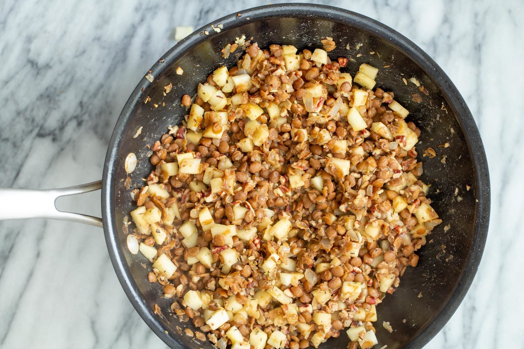 apple lentil stuffing in a frying pan