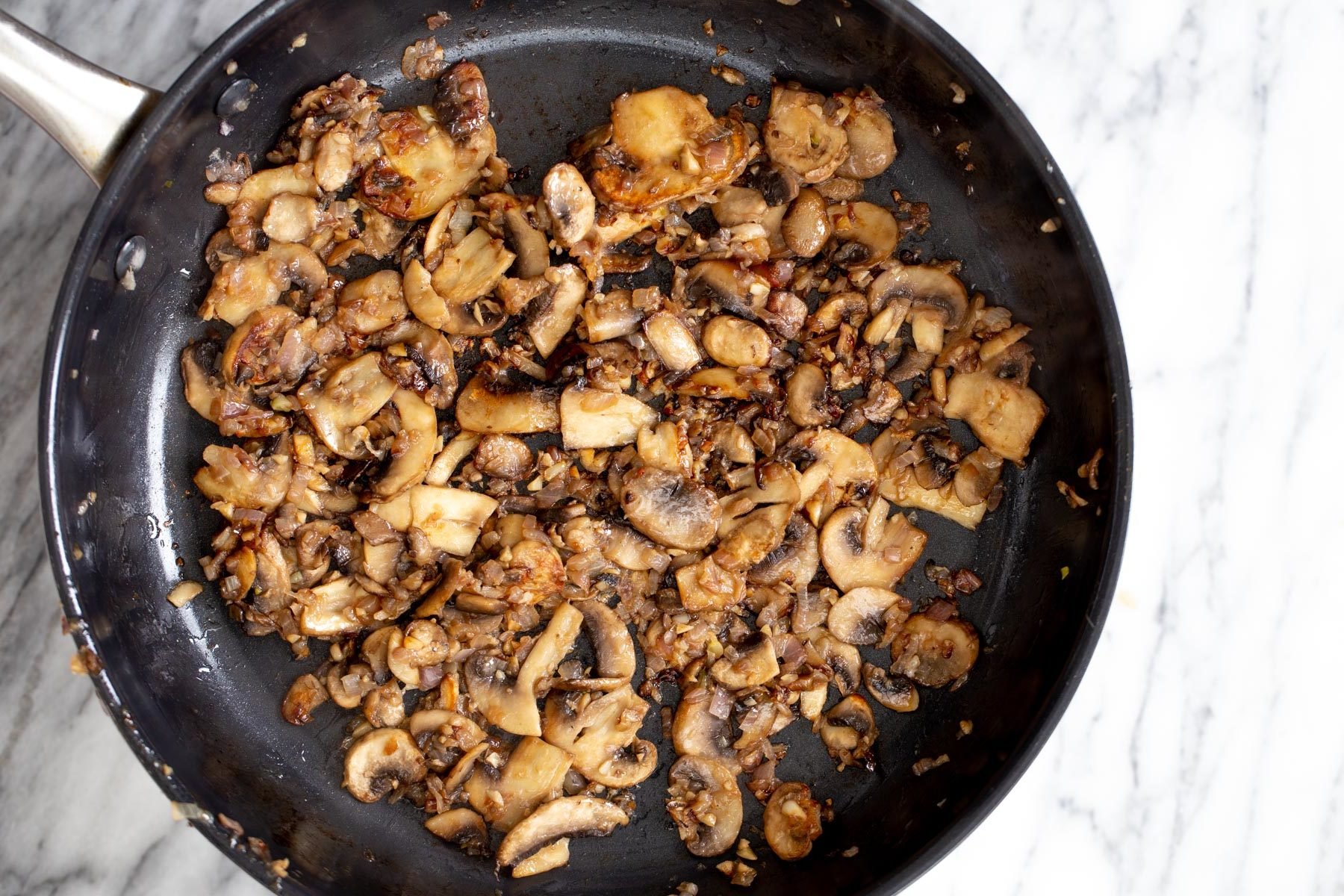 vegan mushrooms stroganoff sauteed mushrooms in a frying pan