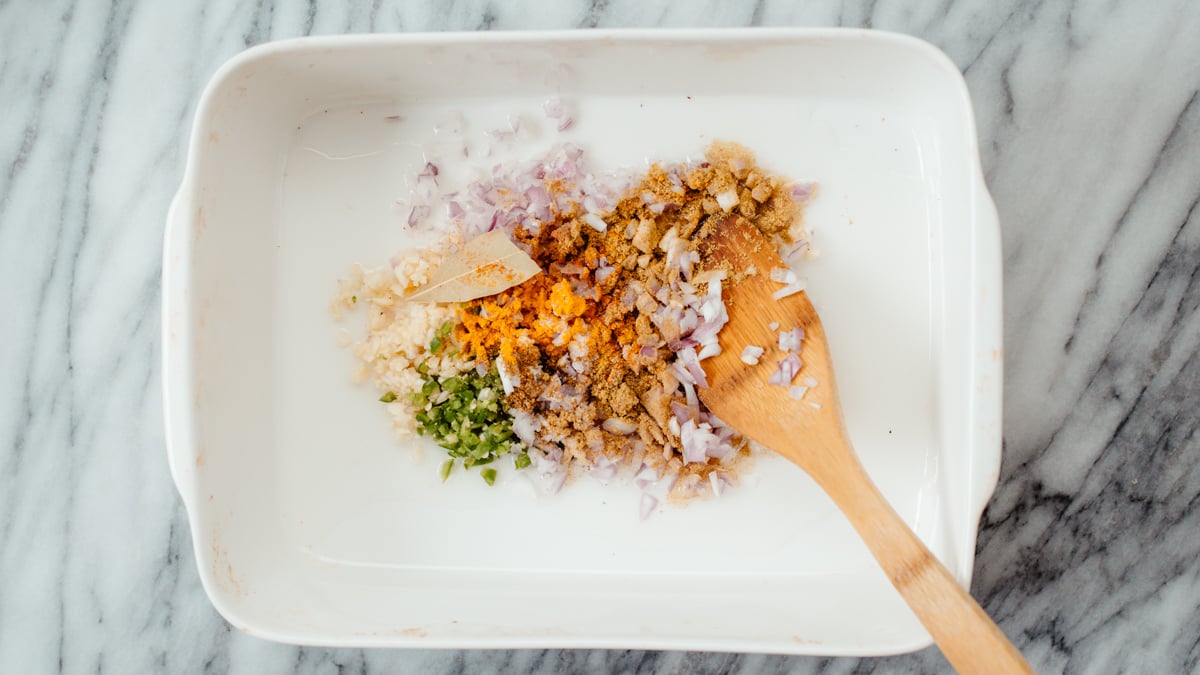 lentil casserole onion, ginger, chili and spices in a casserole dish