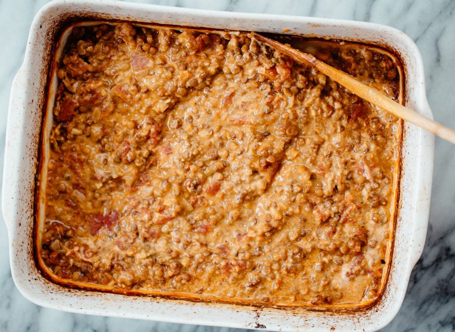 lentil casserole nut butter being stirred into creamy vegan lentil casserole
