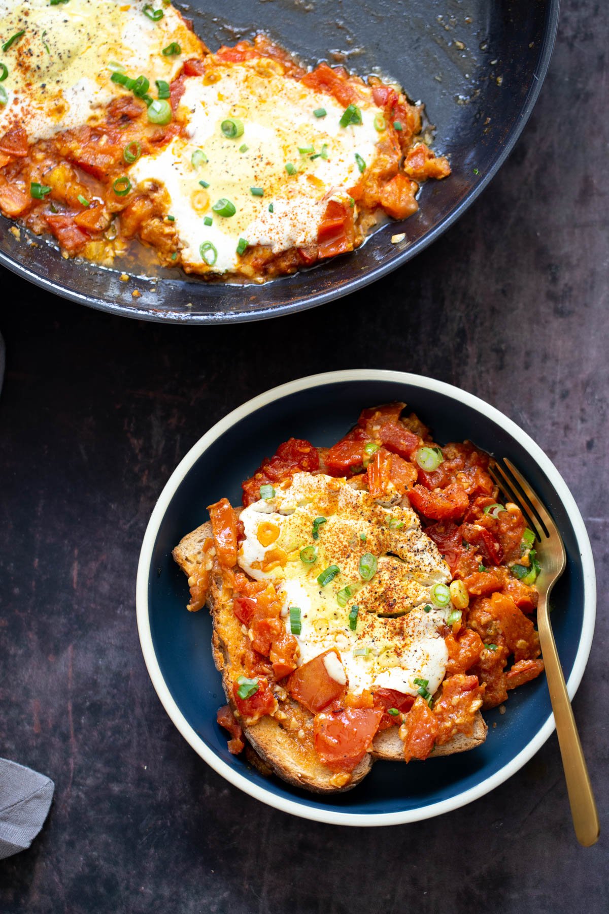 vegan eggs in purgatory overhead shot of two servings of vegan eggs in purgatory made with tofu eggs