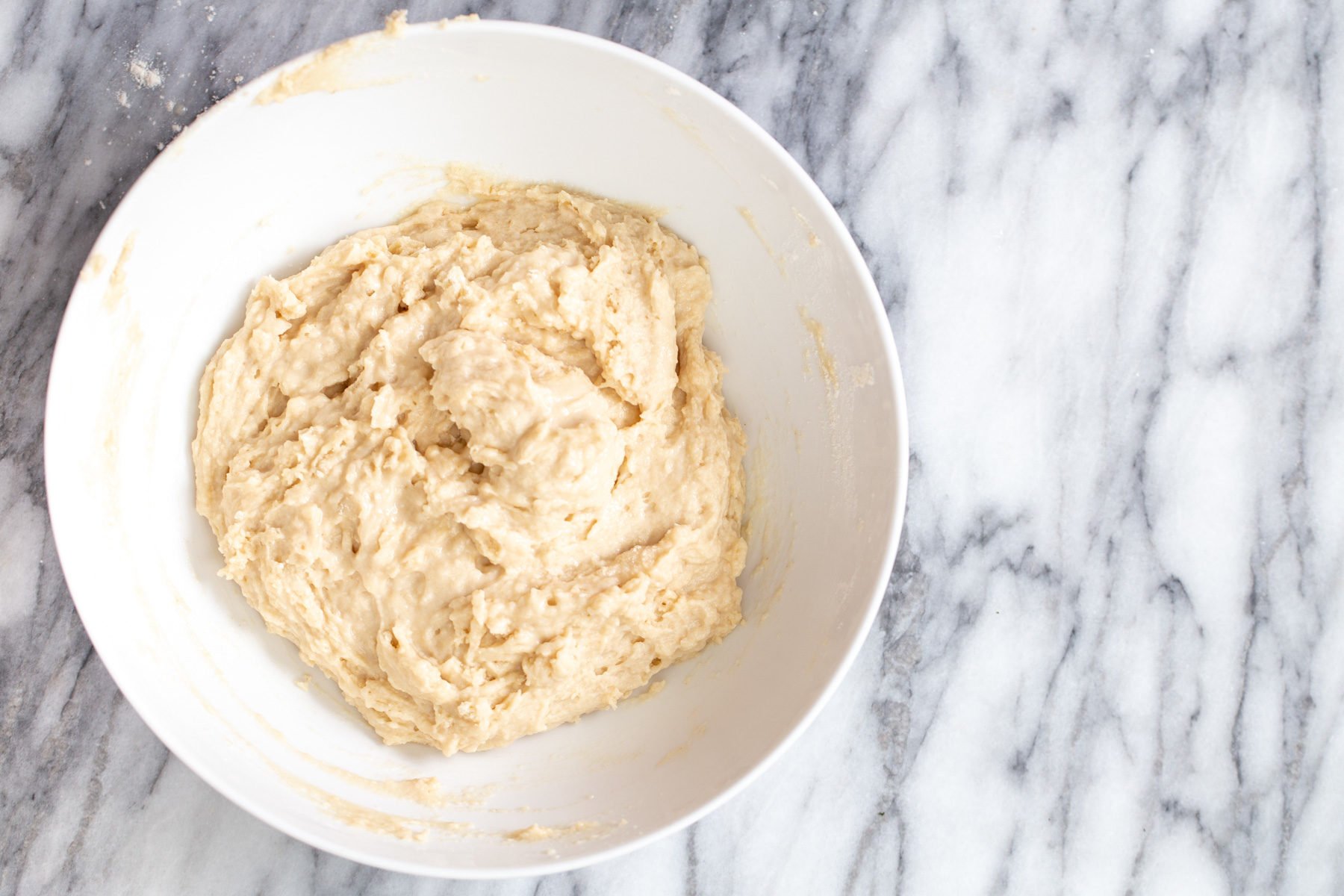 lamington donuts  vegan lamington donut batter being mixed in a bowl