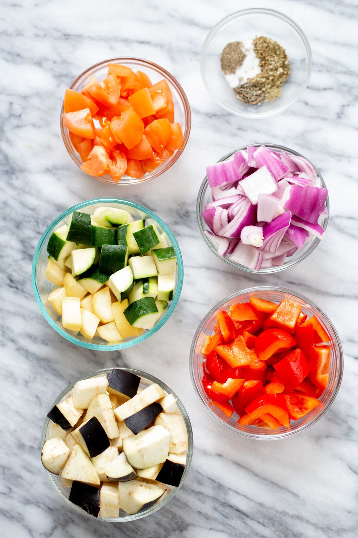 ingredients for baked ratatouille in glass bowls