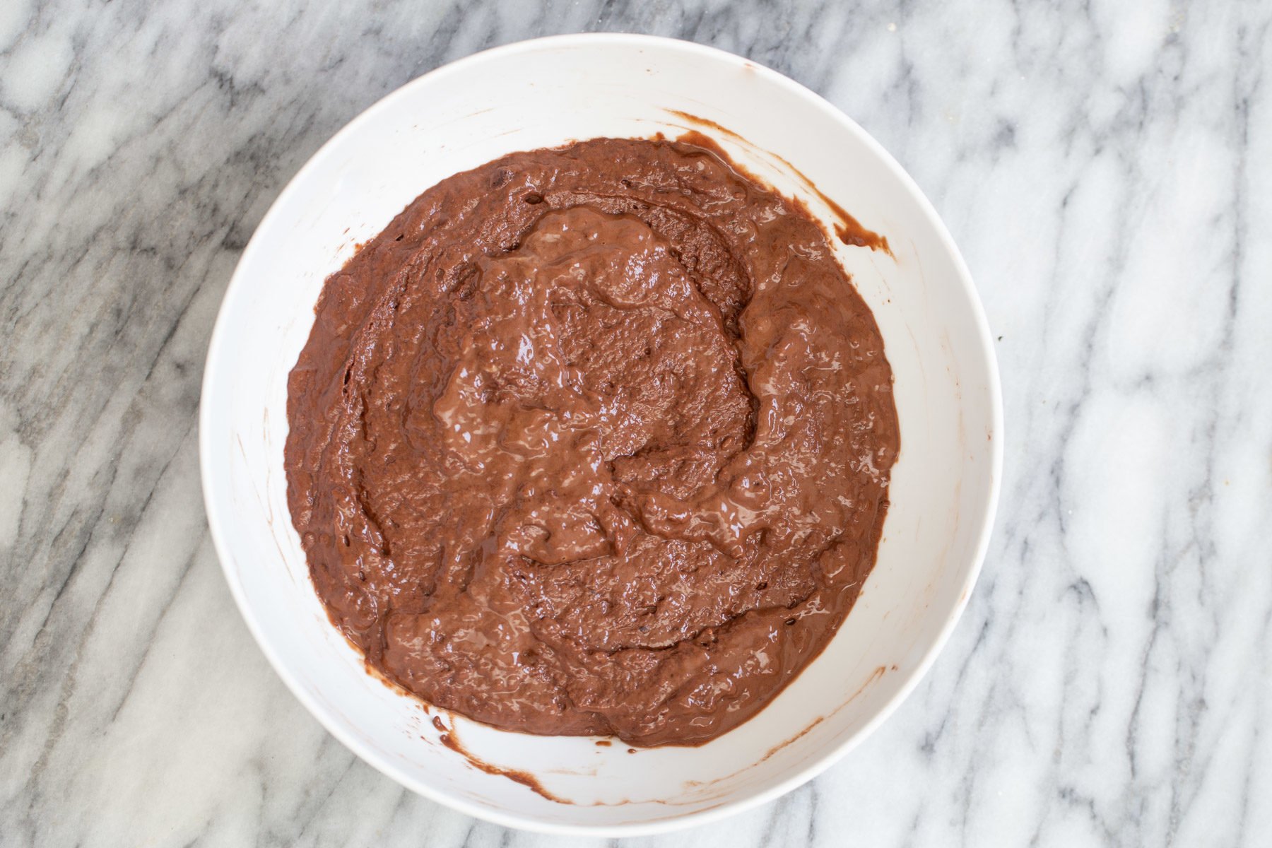German Chocolate Cake vegan german chocolate cake batter in a white bowl