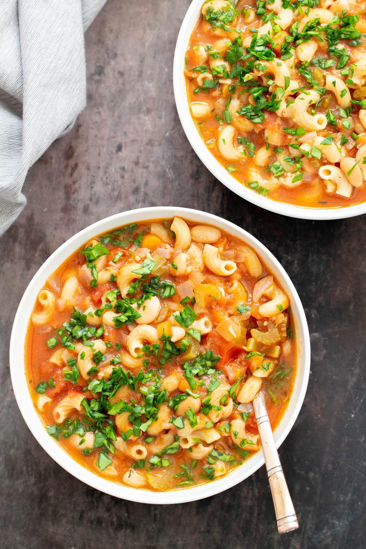 vegan pasta e fagioli  overhead shot of two bowls of vegan pasta e fagioli soup