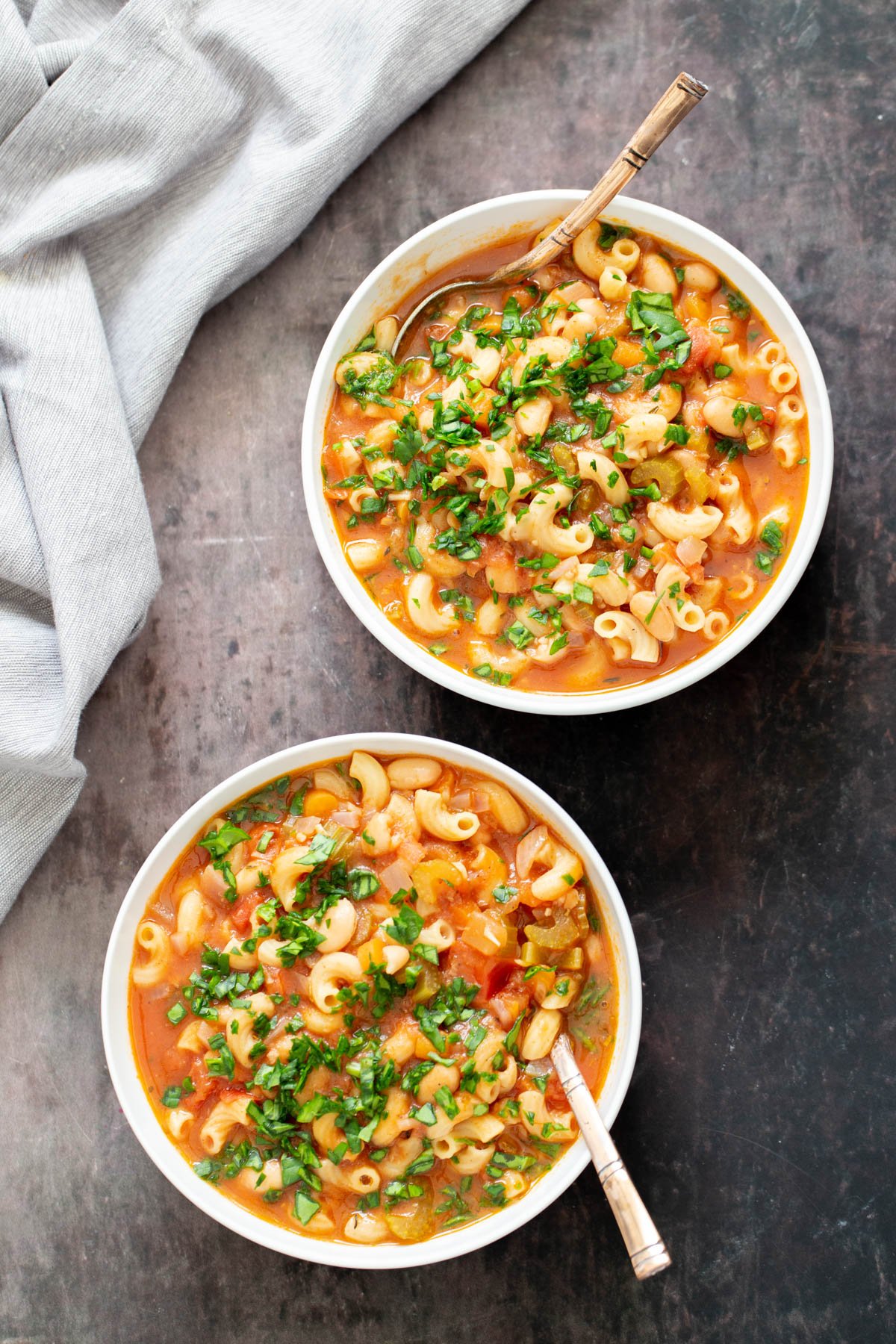 vegan pasta e fagioli two bowls of vegan pasta e fagioli with spoons