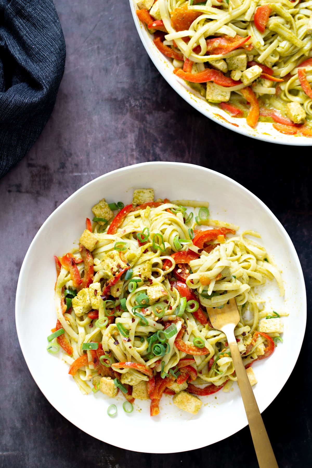Thai Green Curry Noodles  two bowls of thai green curry noodles with pan-fried tofu cubes