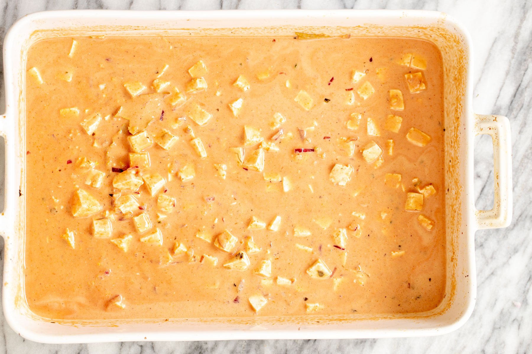 vegan baked tofu in coconut gravy in casserole dish