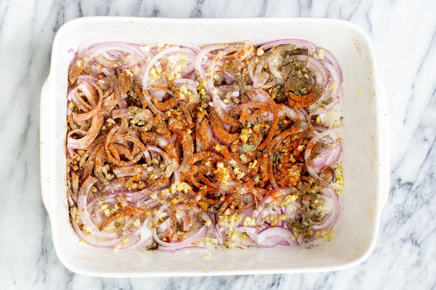 vegetable balti  onions, garlic and ginger in a casserole dish