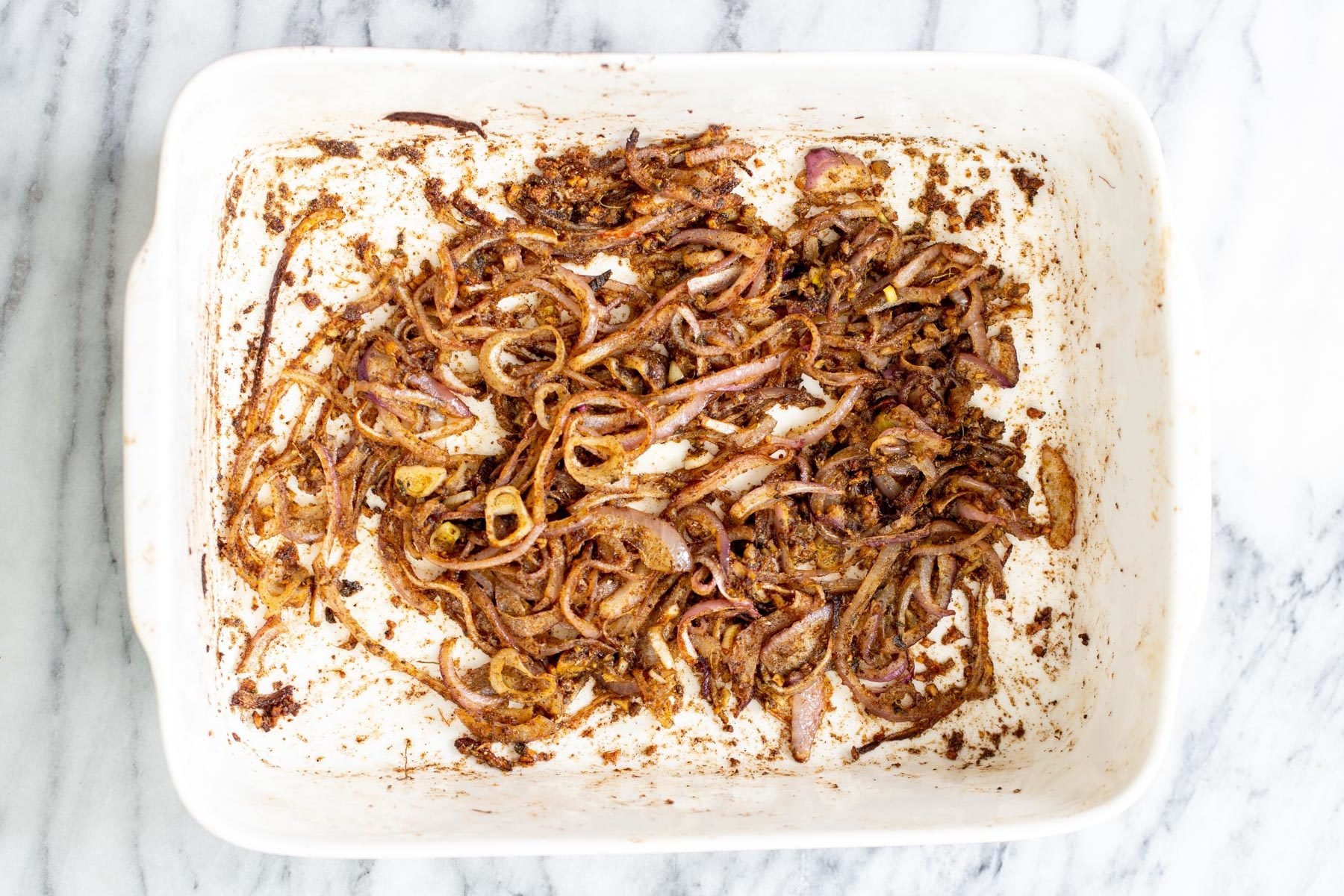onion, garlic and ginger tossed and baked with spices and oil to make balti