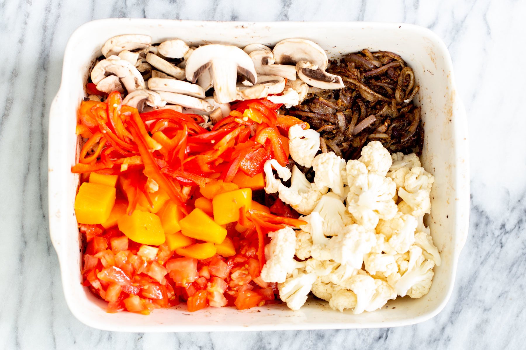 Vegetable Balti  healthy vegetables assembled in a casserole dish to make balti vegetables