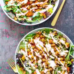 two bowls of sweet potato chickpea salad with tahini dressing