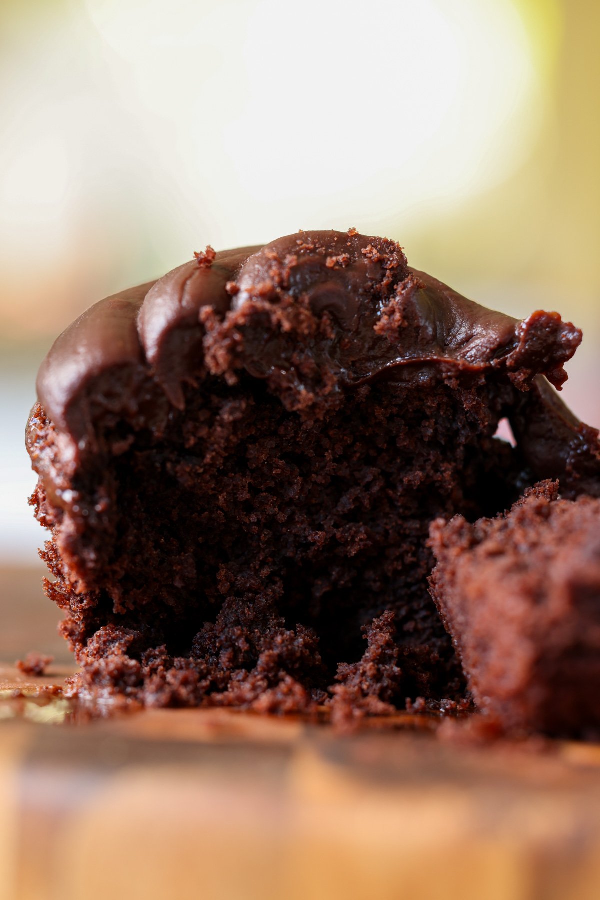 bite shot of vegan gluten-free chocolate cupcake